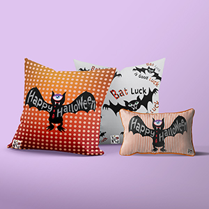 Three halloween pillows with bat themes